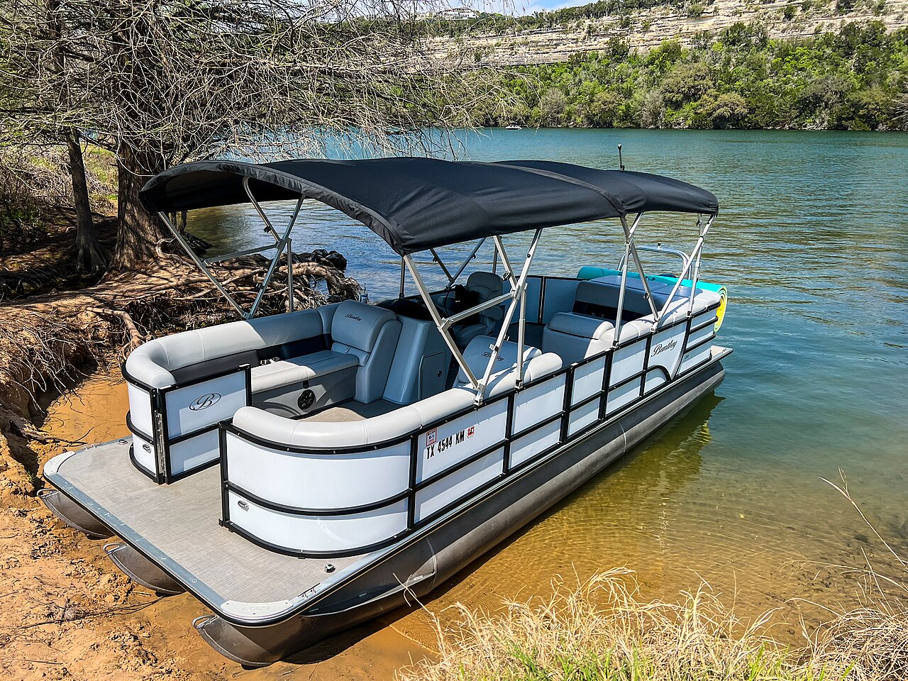 Party pontoon boat moored on a lake